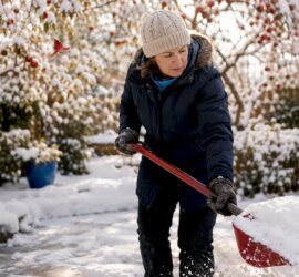Homeowner shoveling snow from driveway