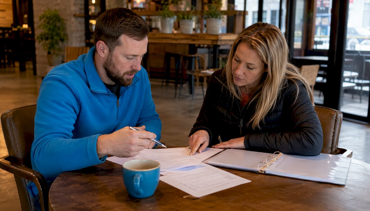 Property managers discussing snow removal contract types