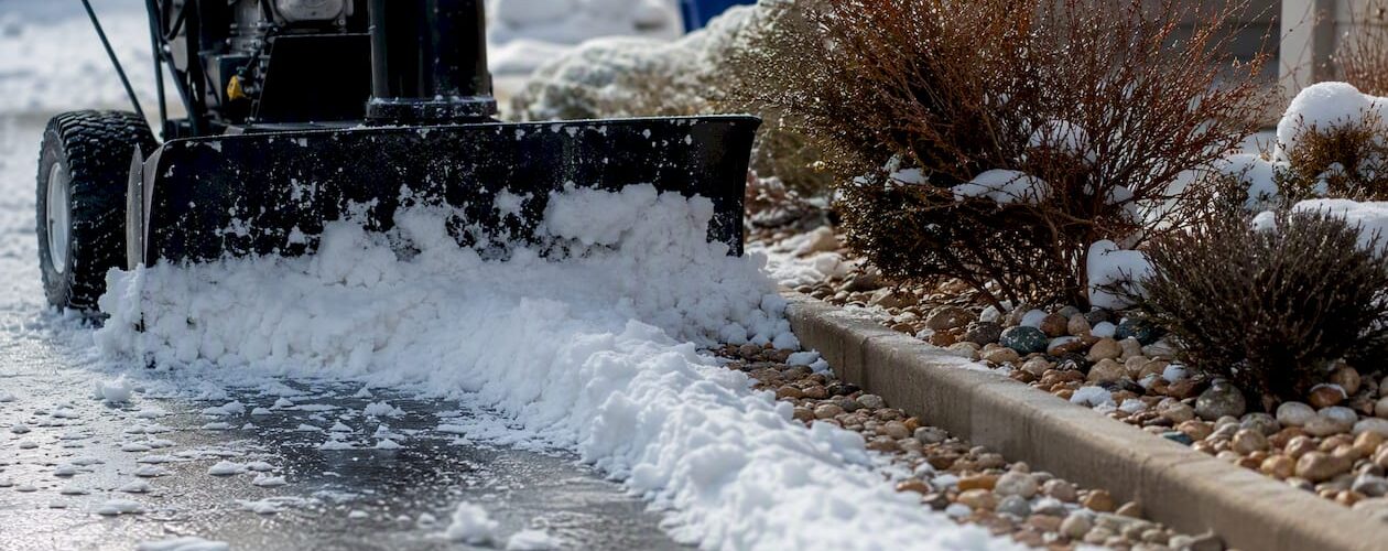 Compact snowblower clearing small driveway