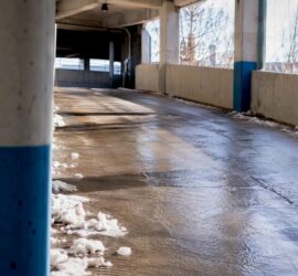 Icy, textured parking garage ramp surface
