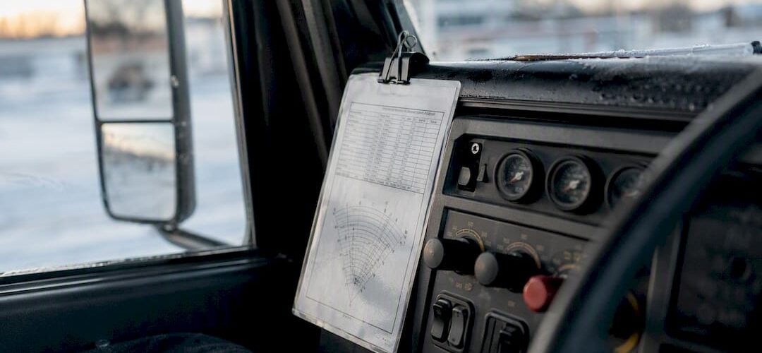Laminated calibration card in snow plow truck cab