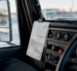 Laminated calibration card in snow plow truck cab