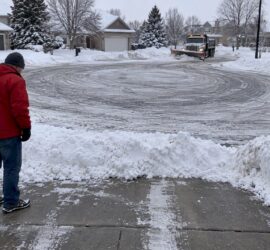 Snow berms blocking cul-de-sac driveway aprons